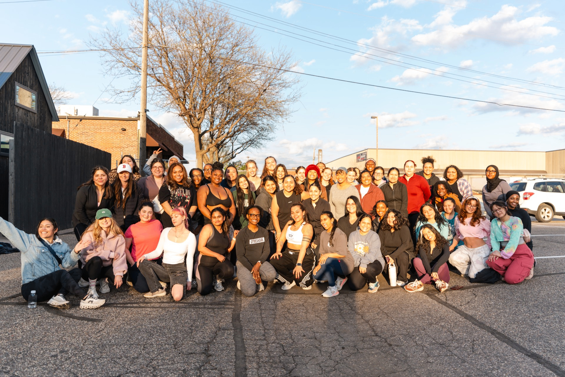 Large group photo of the Reign Region community gathered together after a Turn Up Dance Fitness class